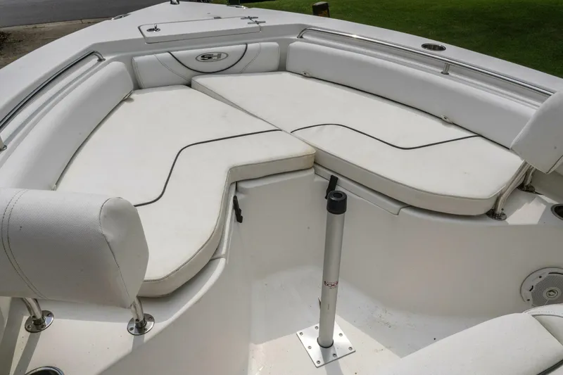 Slide: The Image of 2017 Sea Hunt Ultra 225 boat interior with white cushioned seating and stainless steel fixtures. - 47