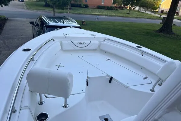 Slide: The Image of 2017 Sea Hunt Ultra 225 boat on trailer, parked in residential driveway. - 60