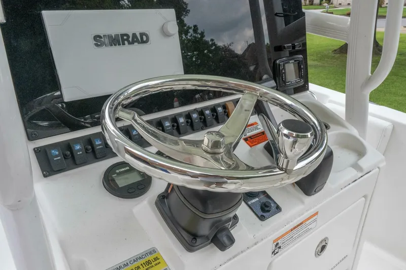 Slide: The Image of Steering console of 2017 Sea Hunt Ultra 225 with Simrad navigation system. - 7