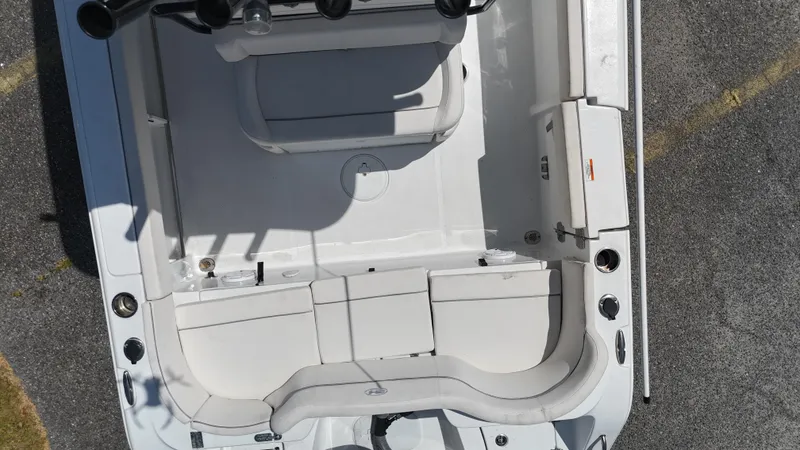 Slide: The Image of 2024 Sea Hunt Ultra 239 SE boat interior, aerial view, showcasing seating and deck layout. - 7