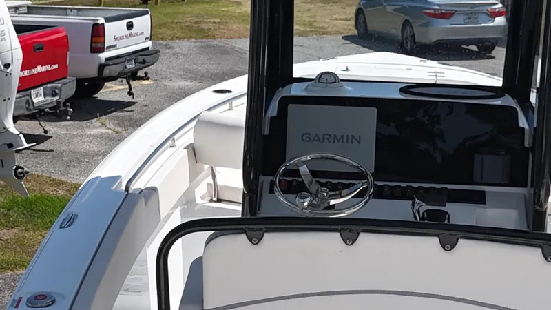 Slide: The Image of 2024 Sea Hunt Ultra 239 SE boat interior with Garmin navigation system. - 9