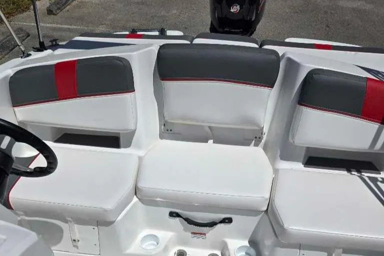 Slide: The Image of 2025 Tahoe T18 boat interior with white and gray seating, red accents. - 4