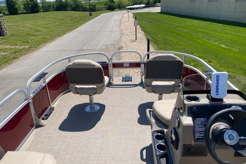 Slide: The Image of 2025 Sun Tracker Bass Buggy 16 XL Select pontoon boat with seating and steering console. - 3