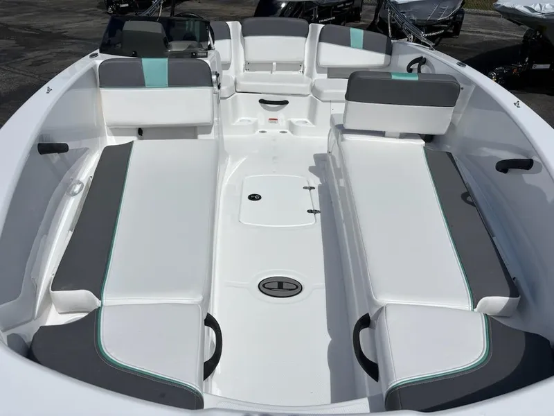 Slide: The Image of 2025 Tahoe T18 boat interior with white and gray seating, modern design. - 4