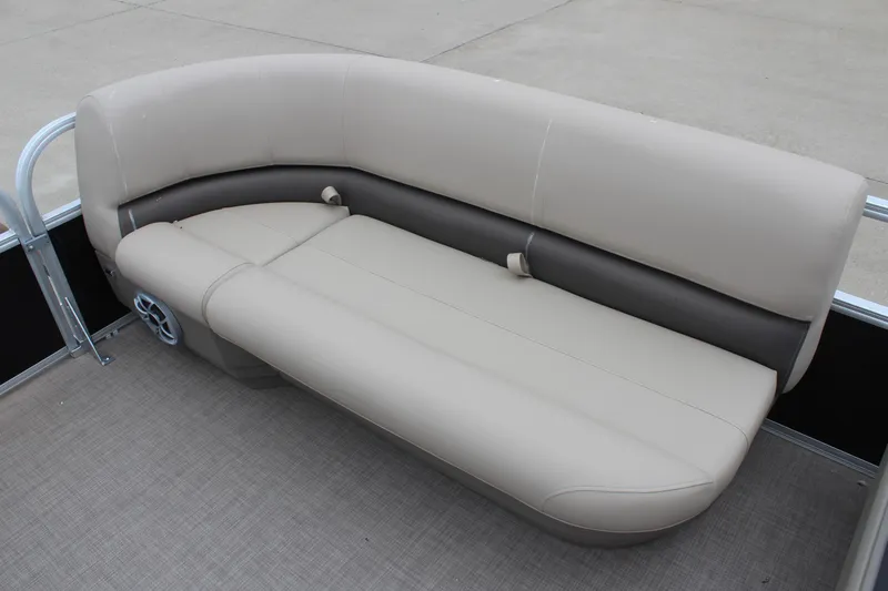 Slide: The Image of 2025 Sun Tracker Party Barge 16 DLX pontoon seating, beige and brown upholstery. - 17