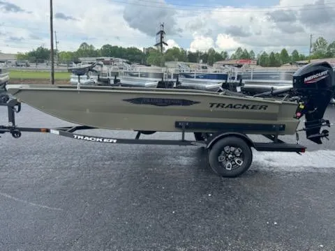 The Image of 2025 Tracker Grizzly 1650 T Prairie Wings Edition boat on trailer, parked outdoors. - 0