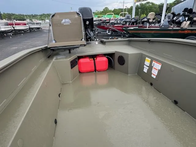 Slide: The Image of 2025 Tracker Grizzly 1650 T Prairie Wings Edition boat interior with storage and seating. - 5