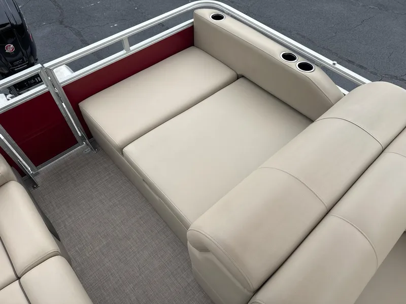Slide: The Image of 2025 Sun Tracker Party Barge 22 RF DLX with beige seating and cup holders. - 4