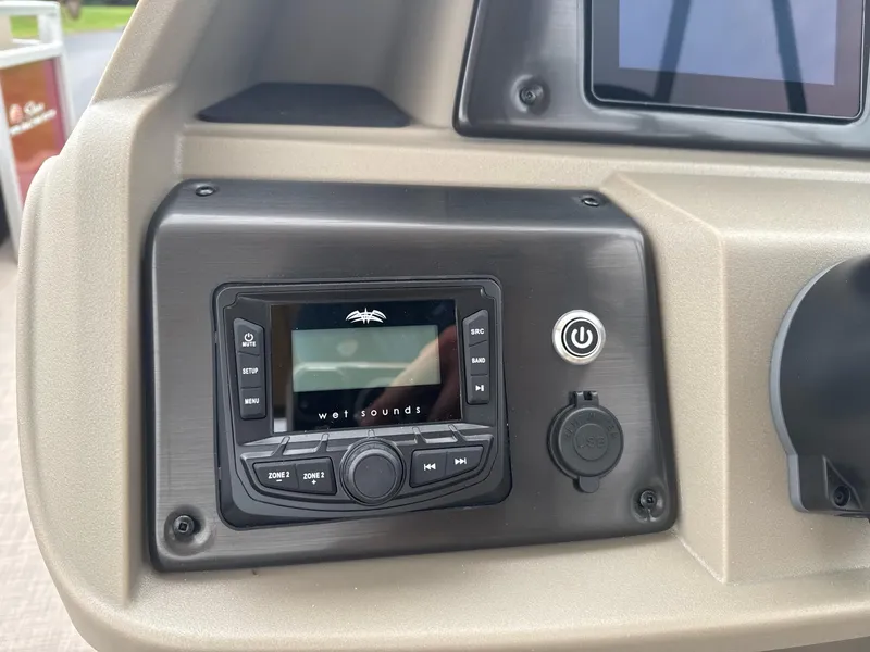 Slide: The Image of Control panel of 2025 Sun Tracker Party Barge 22 RF DLX with audio system. - 9