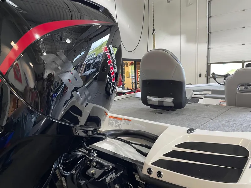 Slide: The Image of 2024 Nitro Z20 boat interior with sleek design and powerful engine in a showroom. - 3