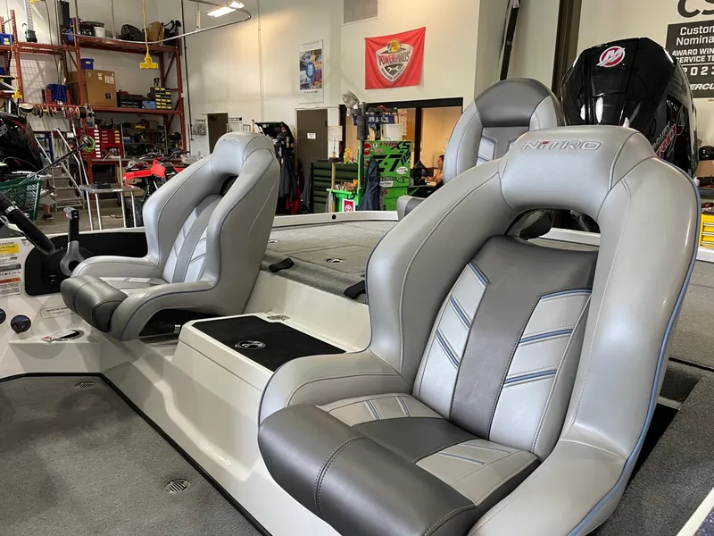 Slide: The Image of 2024 Nitro Z20 boat interior with gray leather seats in a workshop setting. - 4