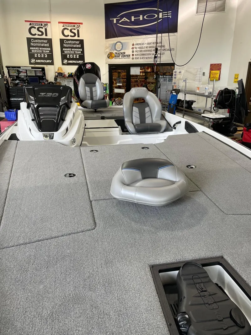 Slide: The Image of 2024 Nitro Z20 boat interior with seating and storage in showroom. - 5