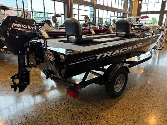 The Image of 2025 Tracker Panfish 17 boat with Mercury engine displayed indoors. - 0