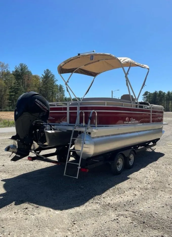 Slide: The Image of 2025 Sun Tracker Party Barge 22 RF DLX pontoon boat with canopy and trailer. - 4
