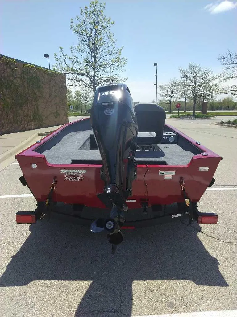 Slide: The Image of 2025 Tracker Super Guide V-16 T boat, rear view in a parking lot. - 3