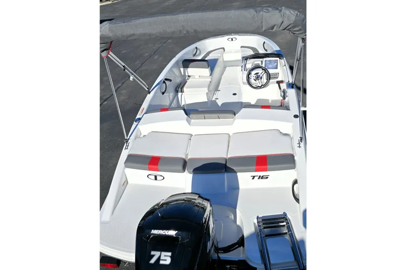 Slide: The Image of 2025 Tahoe T16 boat interior with seating, steering wheel, and Mercury 75 engine. - 12