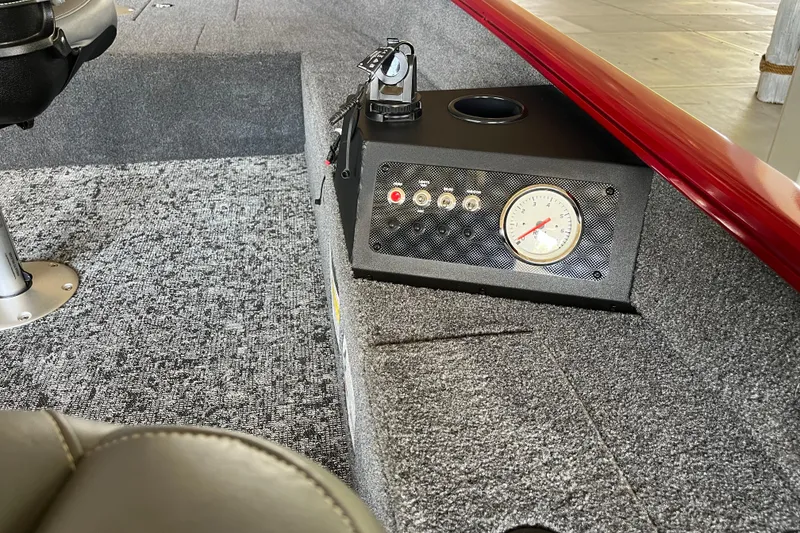Slide: The Image of Interior of 2025 Tracker Super Guide V-16 T boat with control panel and gauge. - 6