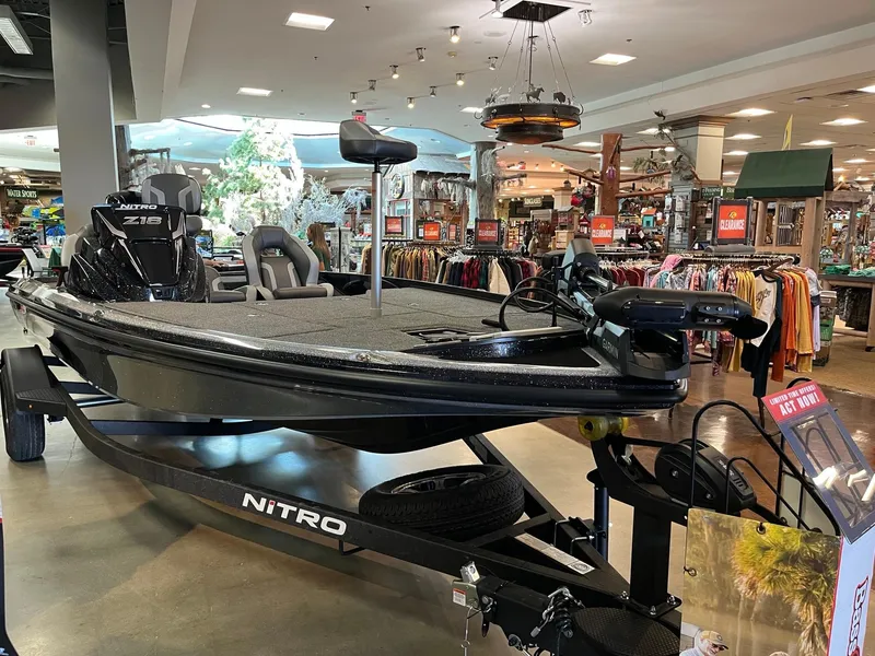Slide: The Image of Nitro Z18 Pro 2025 fishing boat displayed in a store showroom. - 1