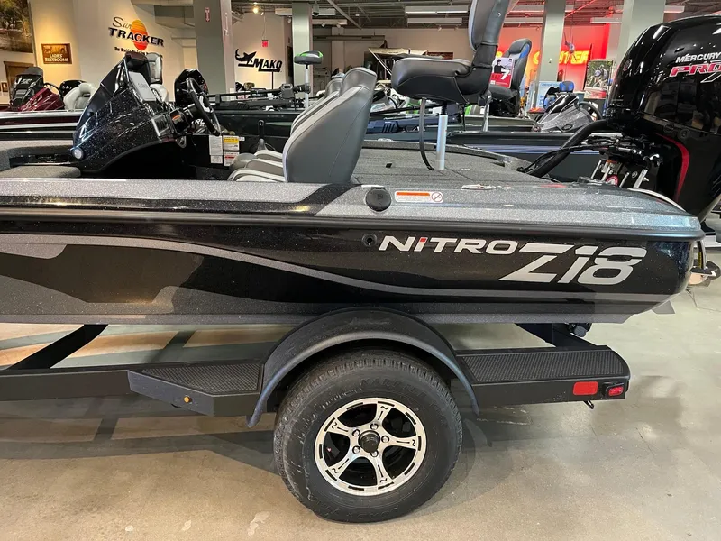 Slide: The Image of 2025 Nitro Z18 Pro fishing boat on display in showroom. - 2
