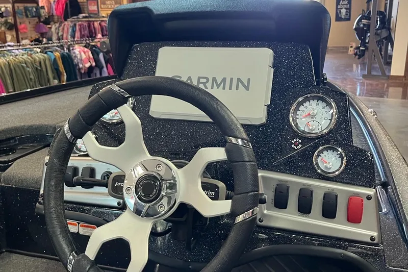 Slide: The Image of Steering wheel and dashboard of 2025 Nitro Z18 Pro boat with Garmin display. - 4