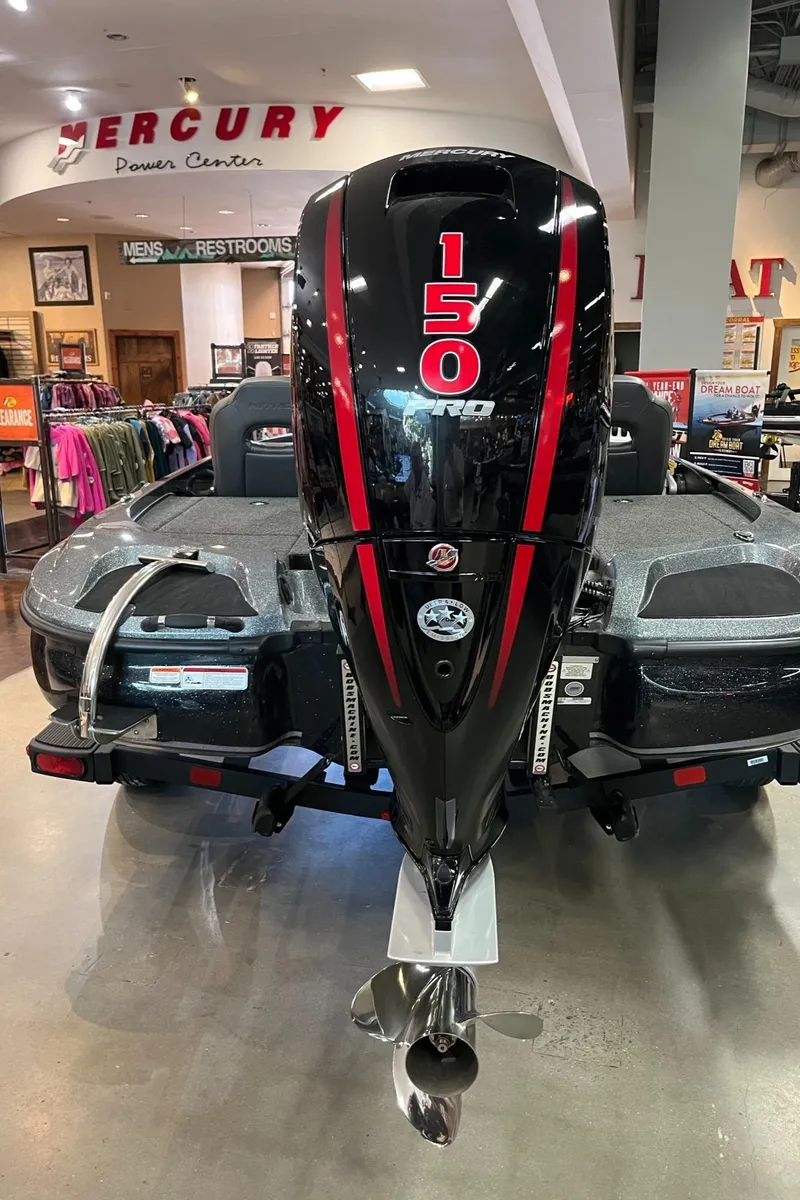 Slide: The Image of 2025 Nitro Z18 Pro boat with Mercury 150 engine displayed indoors. - 6