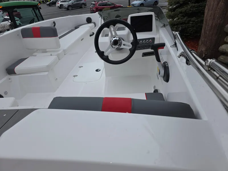 Slide: The Image of 2025 Tahoe T18 boat interior with steering wheel and seating, featuring modern design elements. - 4