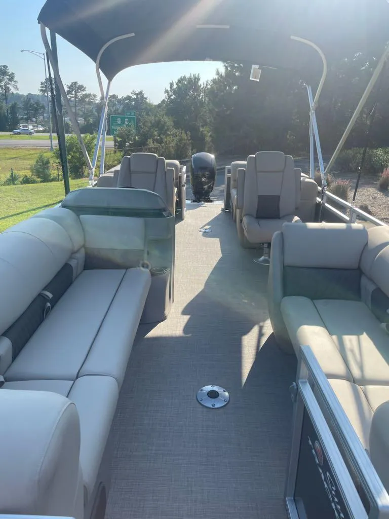 Slide: The Image of 2025 Sun Tracker Party Barge 22 DLX pontoon boat with spacious seating and canopy. - 2