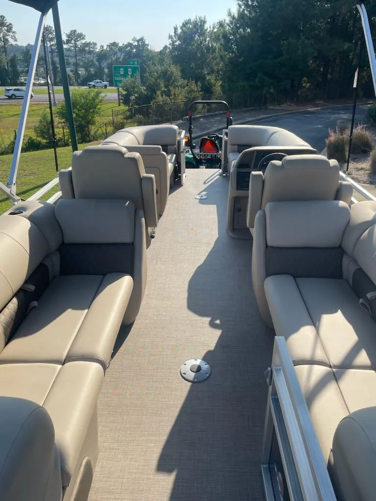 Slide: The Image of 2025 Sun Tracker Party Barge 22 DLX with spacious seating and modern design. - 3