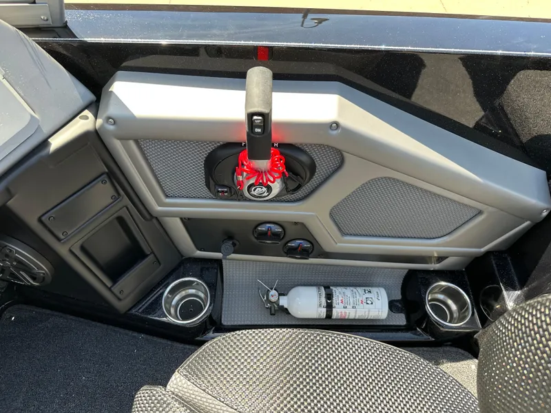 Slide: The Image of 2025 Ranger 620FS Cup Equipped boat interior with control panel and fire extinguisher. - 17