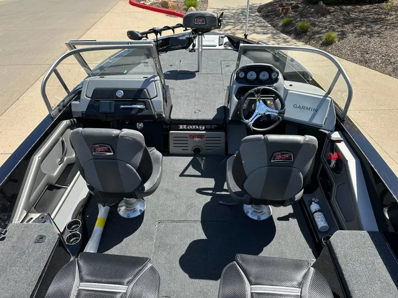 Slide: The Image of 2025 Ranger 620FS Cup Equipped boat interior with dual seats and Garmin navigation system. - 18