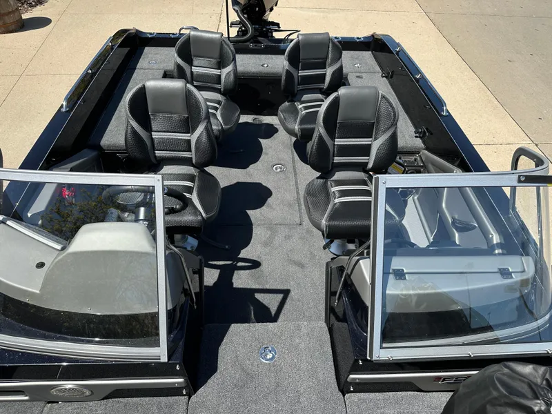Slide: The Image of 2025 Ranger 620FS Cup Equipped boat interior with six seats, black and gray design. - 19