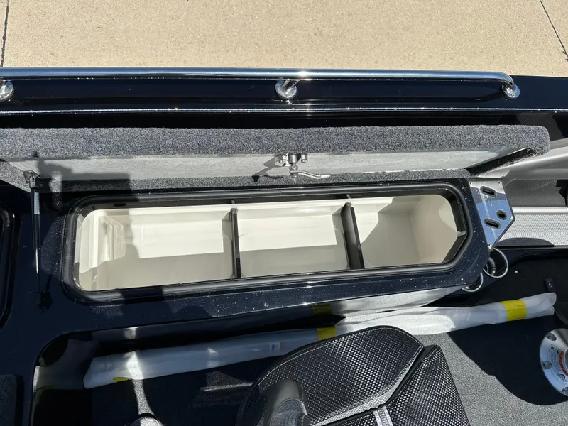 Slide: The Image of 2025 Ranger 620FS Cup Equipped boat storage compartment with open lid, showcasing interior dividers. - 21