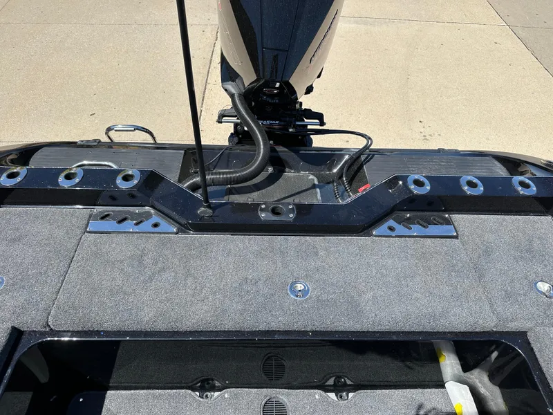 Slide: The Image of 2025 Ranger 620FS Cup Equipped boat deck with motor, showcasing sleek design and functionality. - 23