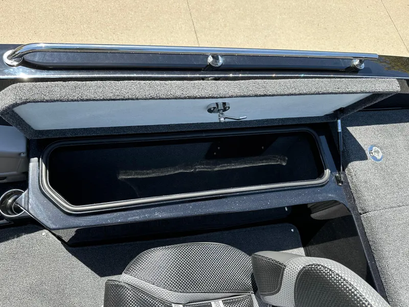 Slide: The Image of 2025 Ranger 620FS Cup Equipped boat storage compartment, open lid, interior view. - 25