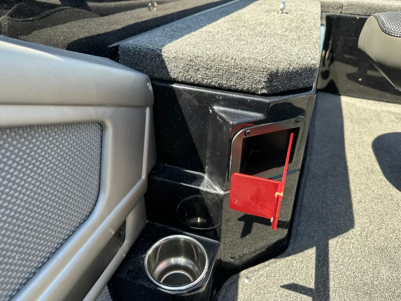 Slide: The Image of 2025 Ranger 620FS Cup Equipped interior with cup holders and storage compartment. - 26