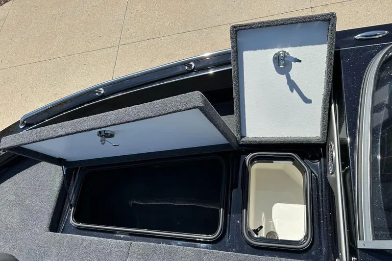 Slide: The Image of 2025 Ranger 620FS Cup Equipped boat storage compartments open, showcasing interior space. - 7
