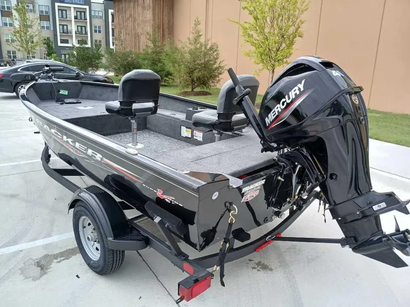 Slide: The Image of 2025 Tracker Super Guide V-16 T boat with Mercury engine on trailer. - 4