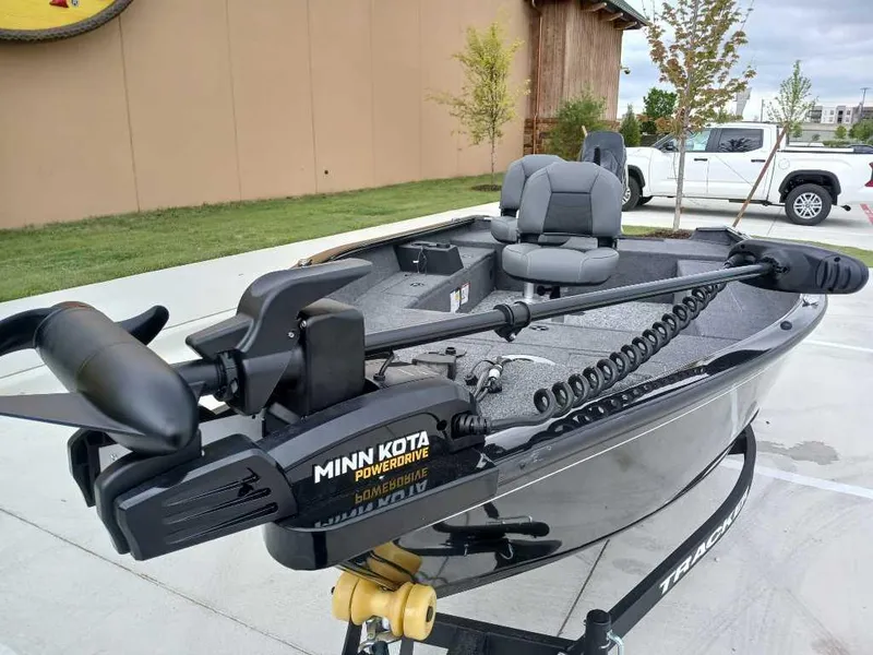 Slide: The Image of 2025 Tracker Super Guide V-16 T boat with Minn Kota PowerDrive motor in parking lot. - 5