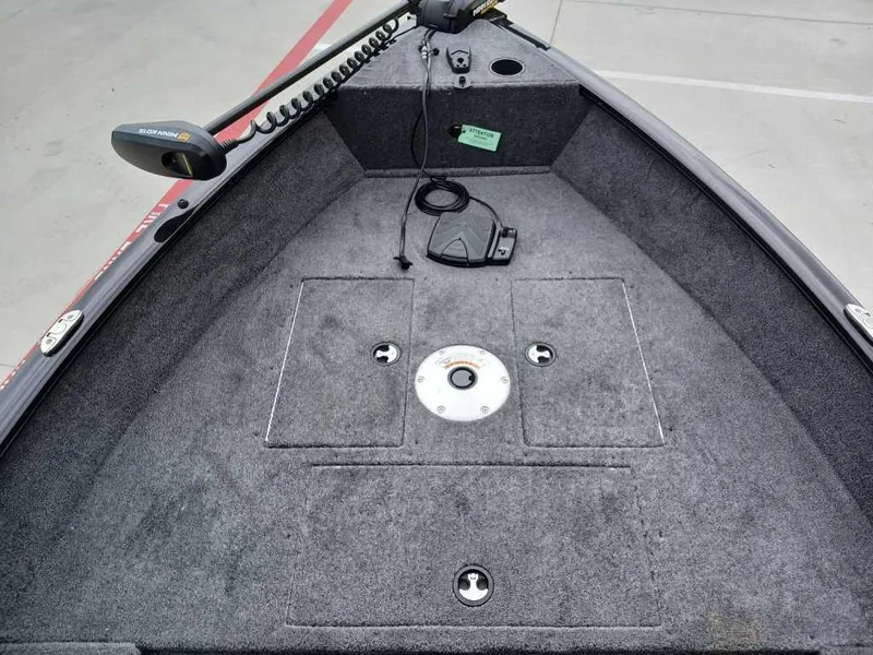 Slide: The Image of 2025 Tracker Super Guide V-16 T boat deck with trolling motor and storage compartments. - 8