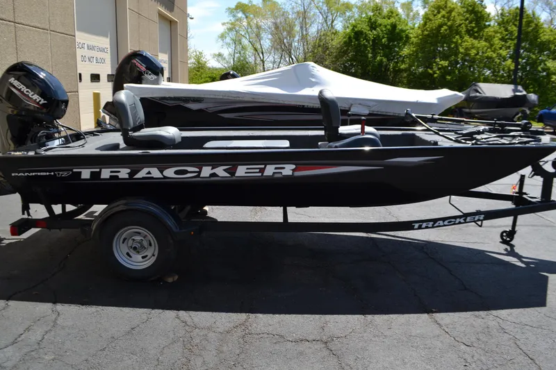 The Image of 2025 Tracker Panfish 17 boat on trailer, parked outdoors. - 0