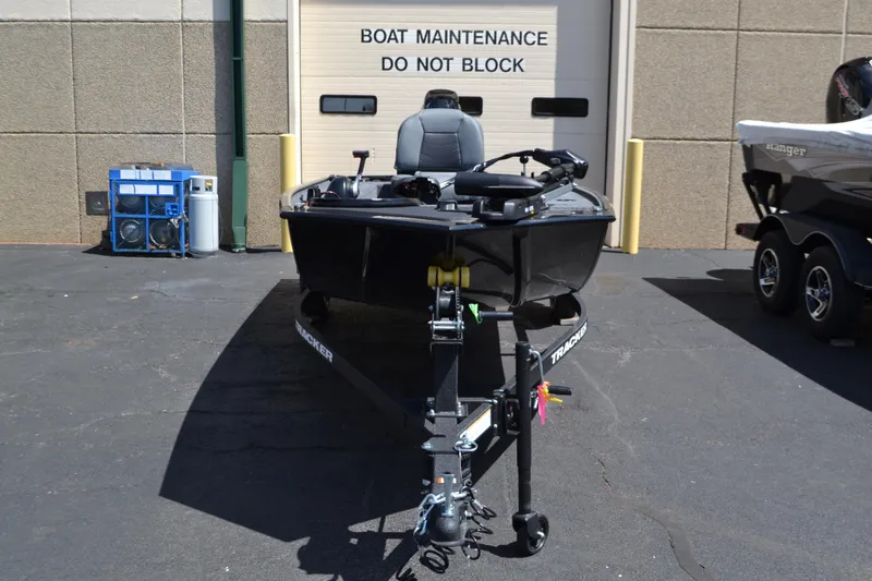 Slide: The Image of 2025 Tracker Panfish 17 boat parked in front of maintenance area. - 3