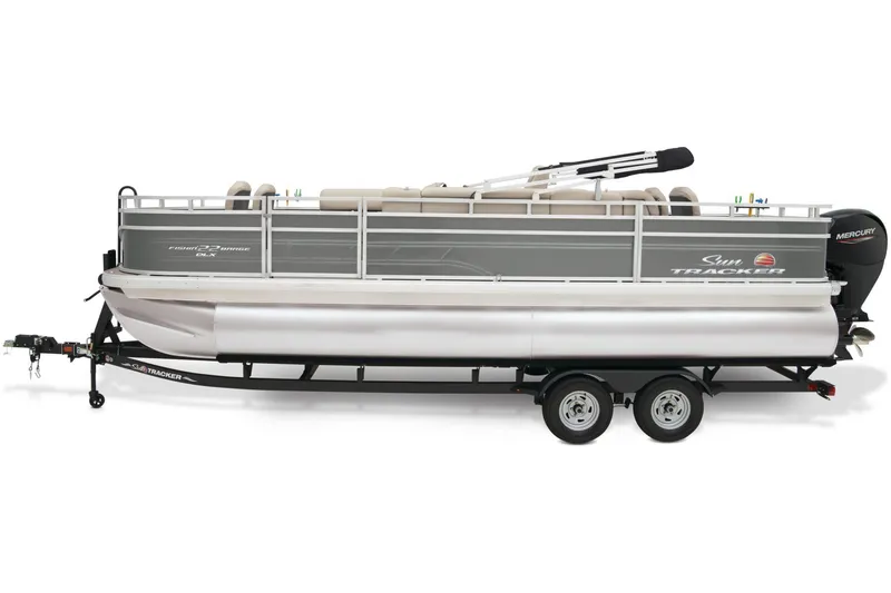 Slide: The Image of 2025 Sun Tracker Fishin' Barge 22 DLX interior with beige seating and carpeted floor. - 6