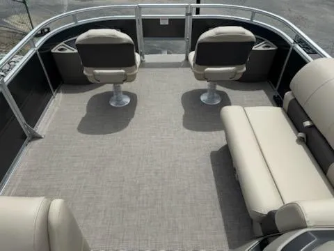 Slide: The Image of 2025 Sun Tracker Fishin' Barge 22 DLX interior with seating and spacious deck. - 8