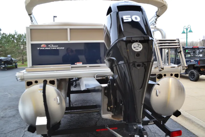Slide: The Image of 2025 Sun Tracker Bass Buggy 16 XL Select with 50 HP outboard motor, rear view. - 2
