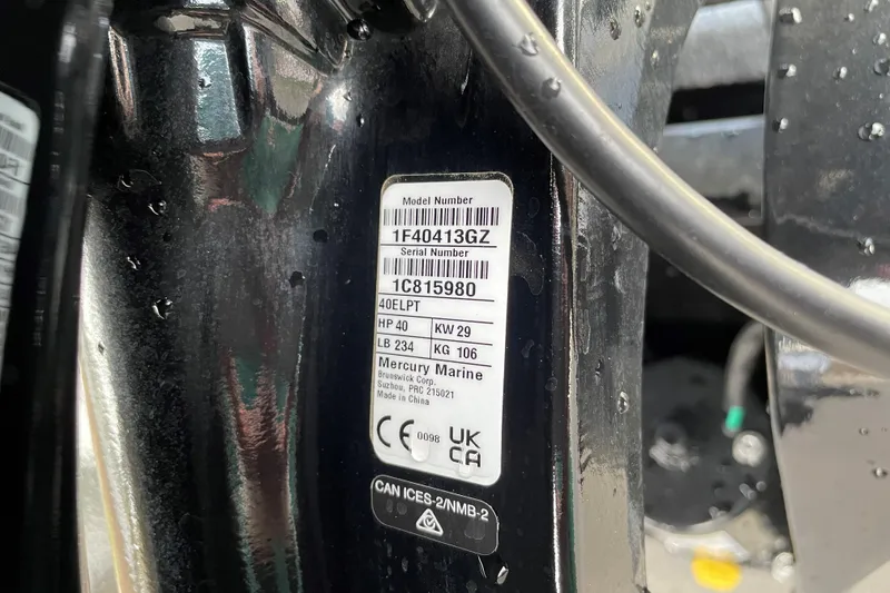 Slide: The Image of Label on 2025 Tracker Panfish 17 boat engine, showing model and serial numbers. - 46