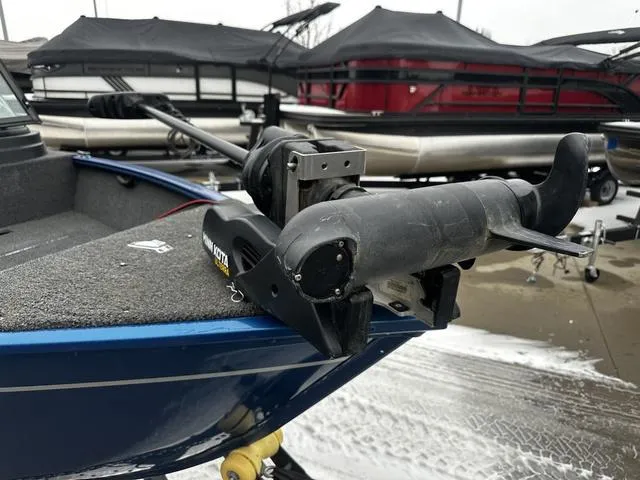 Slide: The Image of 2022 Lund 1650 Rebel XL Sport boat with trolling motor on deck. - 11