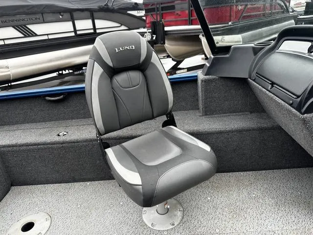 Slide: The Image of 2022 Lund 1650 Rebel XL Sport boat seat, gray and black design. - 9