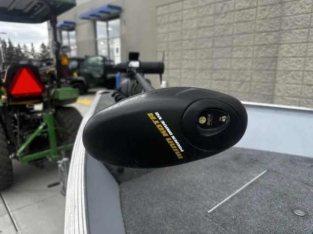 Slide: The Image of Minn Kota trolling motor on 2005 Lund 16 REBEL boat, outdoor setting. - 13