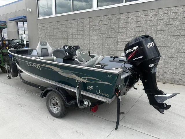 Slide: The Image of 2005 Lund 16 REBEL boat with Mercury 60 outboard motor on trailer. - 4