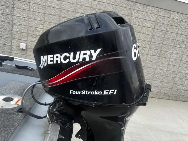 Slide: The Image of Mercury 60 FourStroke EFI outboard motor on 2005 Lund 16 REBEL boat. - 5